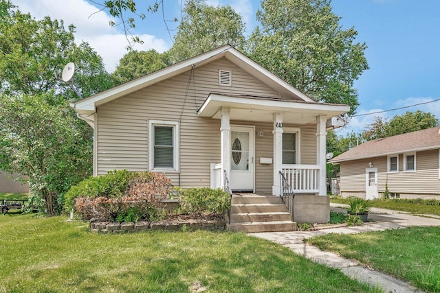610 W S St, Plano, IL 60545 - view of front of home with a front lawn and covered porch