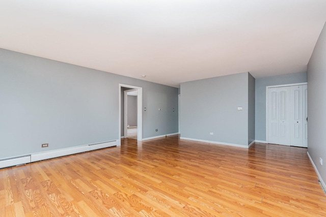 1130 Ontario St Unit B1, Oak Park, IL 60302 - spare room featuring light wood finished floors, baseboards, and baseboard heating