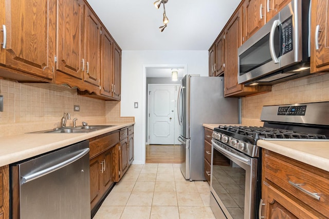 1130 Ontario St Unit B1, Oak Park, IL 60302 - kitchen with stainless steel appliances, a sink, light countertops, and tasteful backsplash