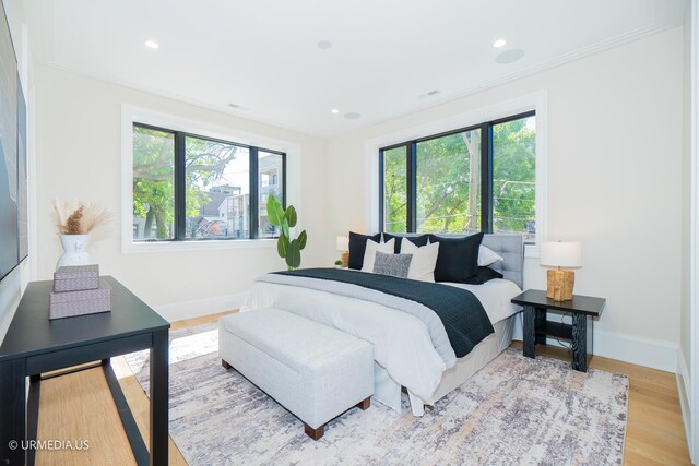 1812 N Howe St Unit Ph, Chicago, IL 60614 - bedroom featuring multiple windows, wood finished floors, baseboards, ornamental molding, and recessed lighting