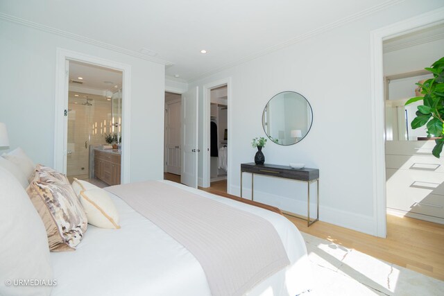 1812 N Howe St Unit Ph, Chicago, IL 60614 - bedroom featuring a spacious closet, wood finished floors, crown molding, ensuite bath, and baseboards