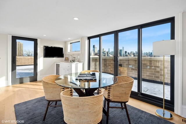 1812 N Howe St Unit Ph, Chicago, IL 60614 - dining room with wood finished floors, wet bar, and recessed lighting