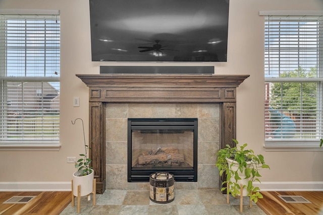 1221 Winding Way, Bolingbrook, IL 60490 - detailed view of wood finished floors, a tile fireplace, and a ceiling fan