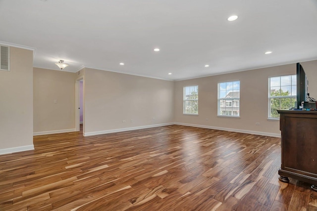 1221 Winding Way, Bolingbrook, IL 60490 - unfurnished room with ornamental molding, wood finished floors, healthy amount of natural light, and recessed lighting