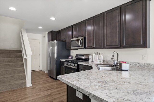 1025 Tuscany Trl, Hampshire, IL 60140 - kitchen with stainless steel appliances, a sink, light countertops, dark brown cabinets, and recessed lighting