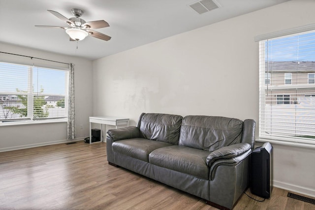 1025 Tuscany Trl, Hampshire, IL 60140 - living area featuring baseboards, wood finished floors, and a ceiling fan