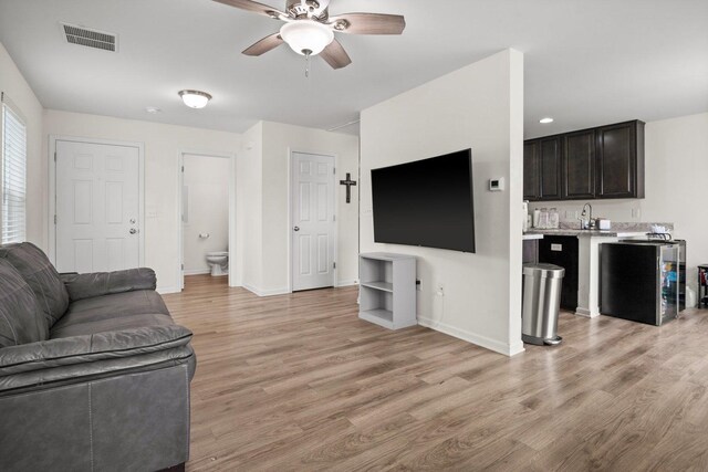 1025 Tuscany Trl, Hampshire, IL 60140 - living room featuring ceiling fan, light wood-style floors, and baseboards