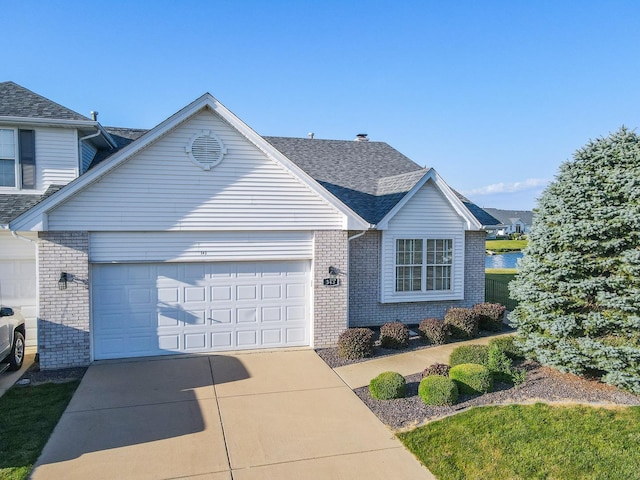343 White Hawk Way, Manteno, IL 60950 - traditional-style home featuring brick siding, an attached garage, concrete driveway, and roof with shingles