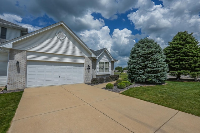 343 White Hawk Way, Manteno, IL 60950 - view of front of home with brick siding, a garage, a front yard, and concrete driveway
