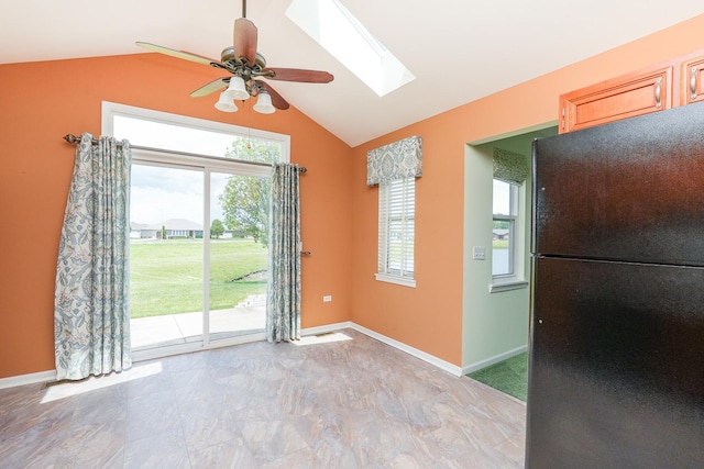 343 White Hawk Way, Manteno, IL 60950 - unfurnished dining area featuring vaulted ceiling, a skylight, and ceiling fan