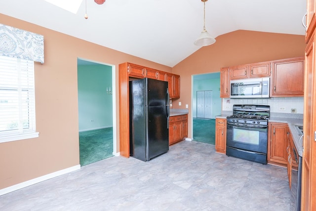 343 White Hawk Way, Manteno, IL 60950 - kitchen with black appliances, lofted ceiling, light countertops, tasteful backsplash, and pendant lighting
