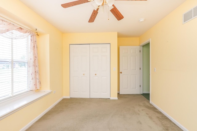 343 White Hawk Way, Manteno, IL 60950 - unfurnished bedroom with carpet flooring, a closet, and a ceiling fan