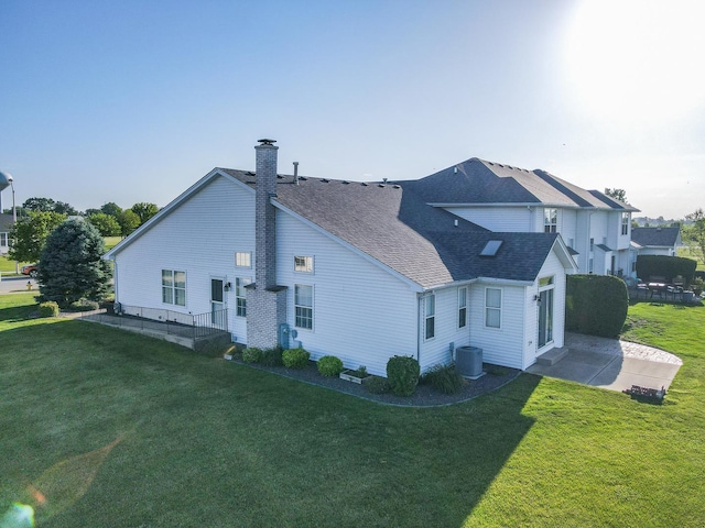 343 White Hawk Way, Manteno, IL 60950 - view of property exterior with a chimney, a lawn, and roof with shingles