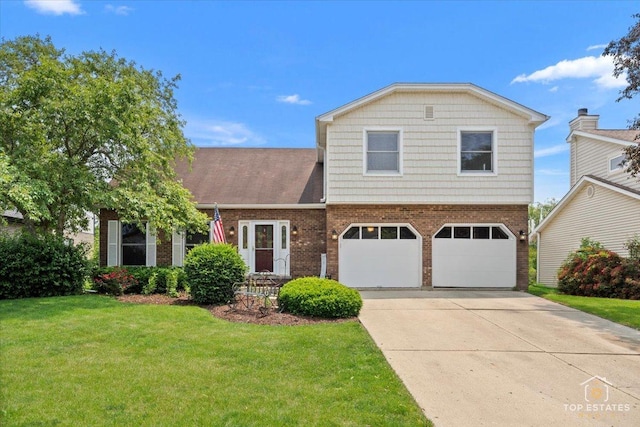 140 Amherst Dr, Bartlett, IL 60103 - view of front facade with brick siding, a front yard, a garage, and driveway
