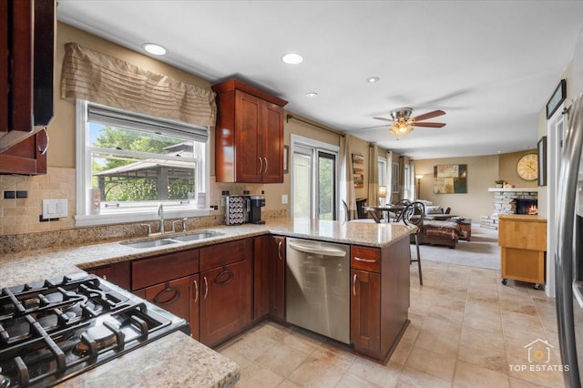 140 Amherst Dr, Bartlett, IL 60103 - kitchen with stainless steel dishwasher, a peninsula, open floor plan, tasteful backsplash, and recessed lighting