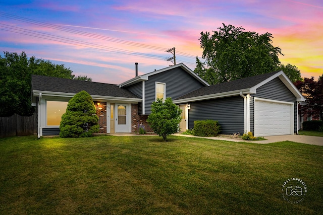 304 Dean Cir, Bolingbrook, IL 60440 - tri-level home featuring a garage, concrete driveway, roof with shingles, and brick siding