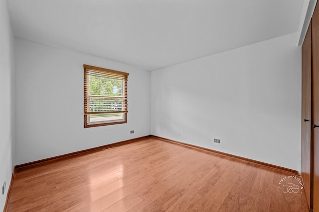 304 Dean Cir, Bolingbrook, IL 60440 - spare room with wood finished floors and baseboards