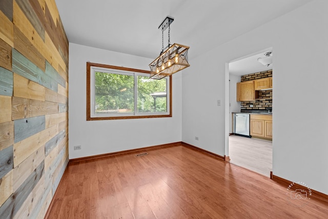 304 Dean Cir, Bolingbrook, IL 60440 - unfurnished dining area with light wood-type flooring and baseboards