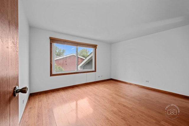 304 Dean Cir, Bolingbrook, IL 60440 - empty room featuring wood finished floors and baseboards