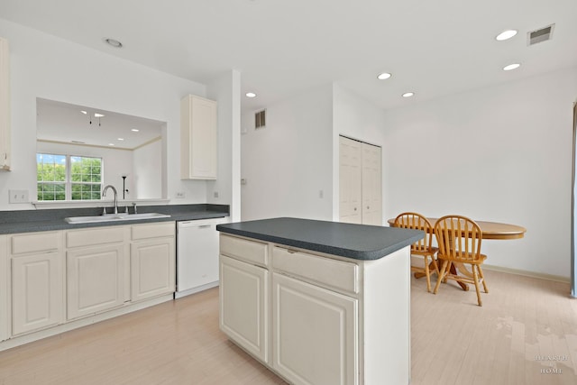 31782 N Pineview Blvd, Lakemoor, IL 60051 - kitchen with dishwasher, a sink, dark countertops, light wood-style floors, and recessed lighting