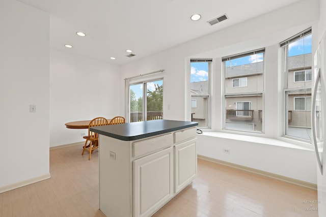31782 N Pineview Blvd, Lakemoor, IL 60051 - kitchen featuring dark countertops, light wood-type flooring, baseboards, recessed lighting, and a center island