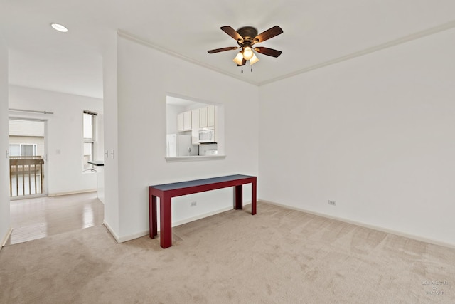 31782 N Pineview Blvd, Lakemoor, IL 60051 - empty room with light carpet, a ceiling fan, and baseboards