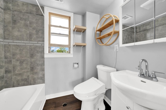 4501 S Kilpatrick Ave, Chicago, IL 60632 - full bathroom featuring healthy amount of natural light, baseboards, toilet, and wood finished floors