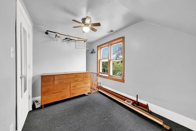 4501 S Kilpatrick Ave, Chicago, IL 60632 - unfurnished bedroom with dark carpet, vaulted ceiling, baseboards, and ceiling fan