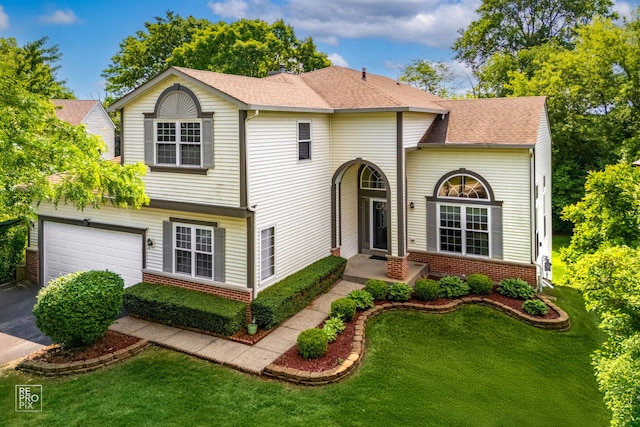 7623 Beringer Ct, Gurnee, IL 60031 - traditional home featuring concrete driveway, brick siding, a garage, a front yard, and a shingled roof