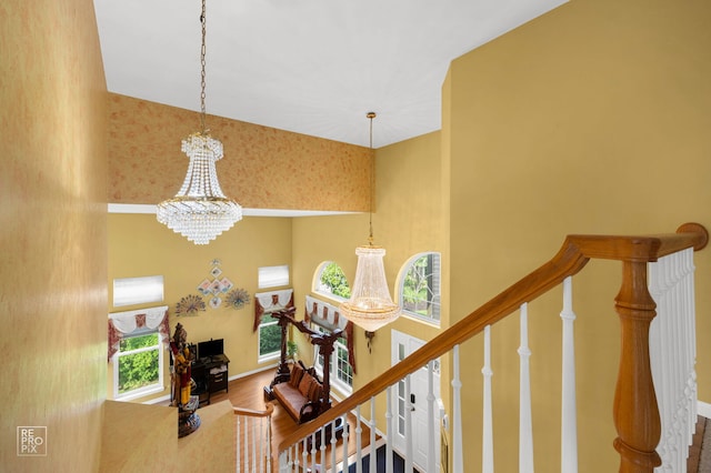 7623 Beringer Ct, Gurnee, IL 60031 - stairs with a chandelier and wood finished floors