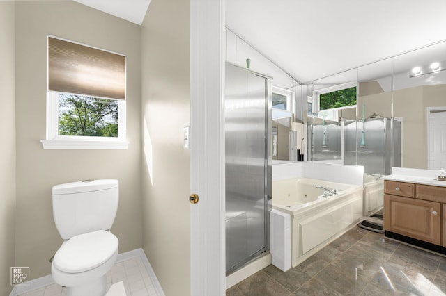 7623 Beringer Ct, Gurnee, IL 60031 - bathroom with vanity, a whirlpool tub, a stall shower, and vaulted ceiling