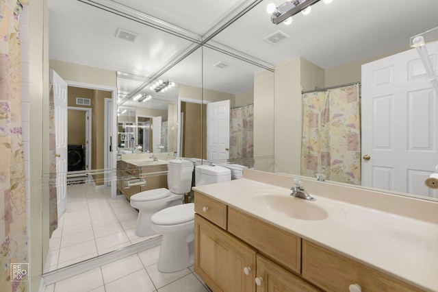 7623 Beringer Ct, Gurnee, IL 60031 - bathroom featuring tile patterned floors, washer / dryer, a bidet, and vanity