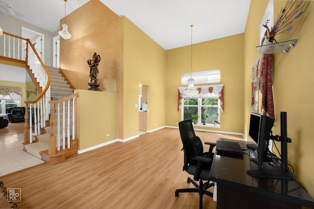 7623 Beringer Ct, Gurnee, IL 60031 - office space featuring a high ceiling, healthy amount of natural light, and wood finished floors