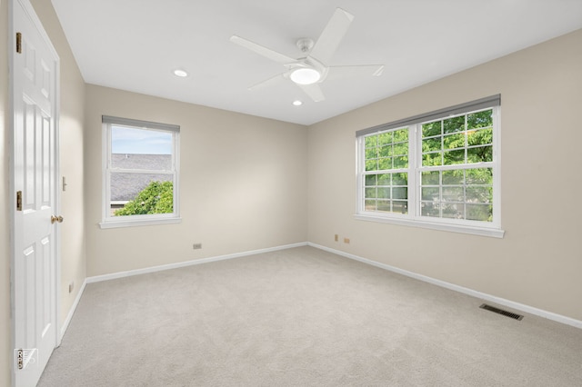 7623 Beringer Ct, Gurnee, IL 60031 - spare room featuring light colored carpet, healthy amount of natural light, a ceiling fan, and recessed lighting
