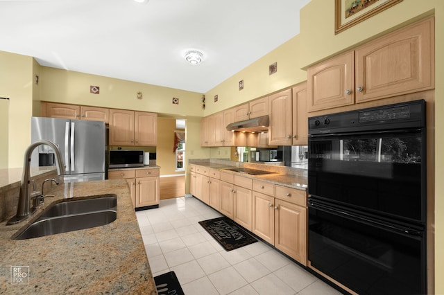 7623 Beringer Ct, Gurnee, IL 60031 - kitchen with black appliances, light brown cabinetry, light stone counters, light tile patterned floors, and under cabinet range hood