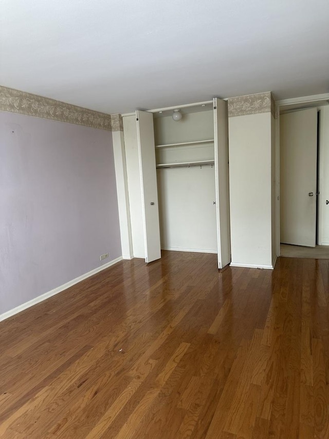 4800 S Chicago Beach Dr Unit 910S, Chicago, IL 60615 - unfurnished bedroom featuring wood finished floors and multiple closets
