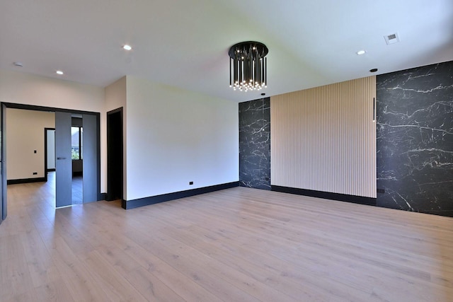 332 W Fremont Ave, Elmhurst, IL 60126 - unfurnished room featuring wallpapered walls, an accent wall, wood finished floors, and recessed lighting