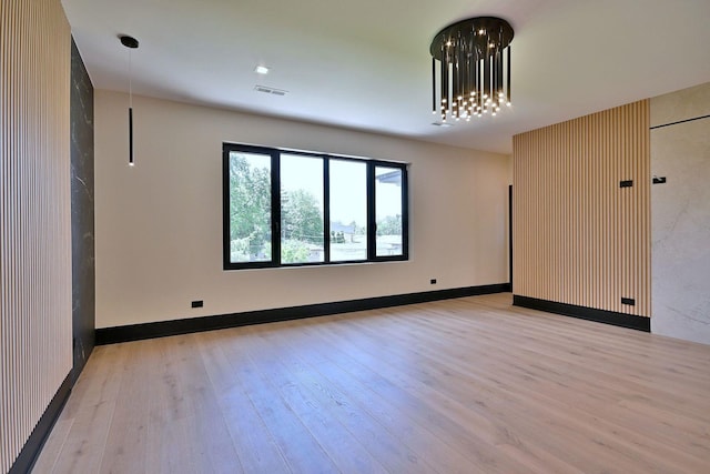 332 W Fremont Ave, Elmhurst, IL 60126 - spare room featuring wood finished floors and a chandelier