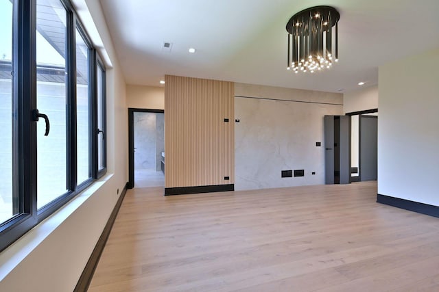332 W Fremont Ave, Elmhurst, IL 60126 - unfurnished room with light wood-style floors, plenty of natural light, a chandelier, and recessed lighting