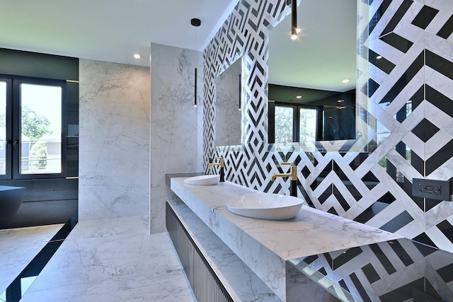 332 W Fremont Ave, Elmhurst, IL 60126 - full bath featuring double vanity, walk in shower, recessed lighting, marble tiled flooring, and tile walls