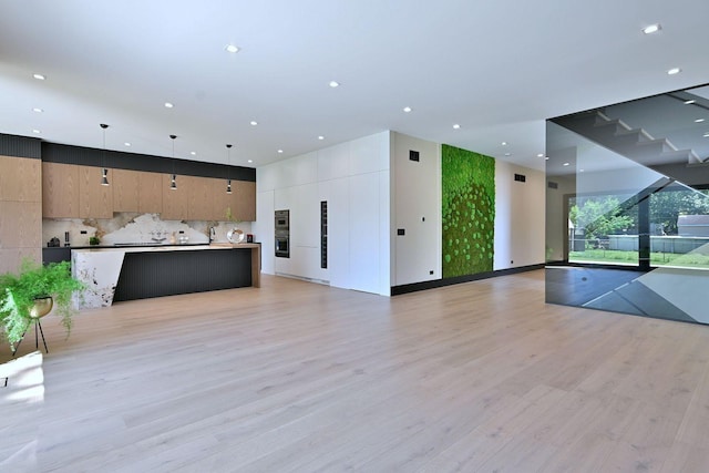 332 W Fremont Ave, Elmhurst, IL 60126 - unfurnished living room featuring light wood-type flooring and recessed lighting