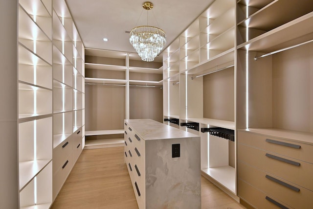 332 W Fremont Ave, Elmhurst, IL 60126 - walk in closet featuring light wood-style flooring and a chandelier