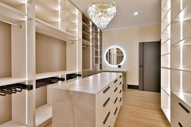 332 W Fremont Ave, Elmhurst, IL 60126 - walk in closet with light wood-style flooring and a chandelier