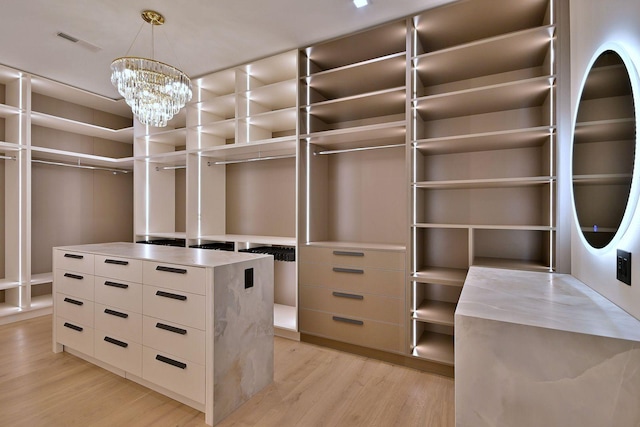332 W Fremont Ave, Elmhurst, IL 60126 - spacious closet with light wood-style flooring and a chandelier