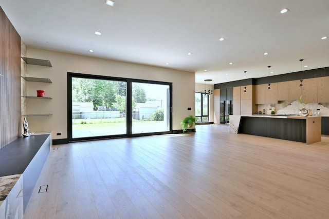332 W Fremont Ave, Elmhurst, IL 60126 - unfurnished living room with light wood-type flooring and recessed lighting