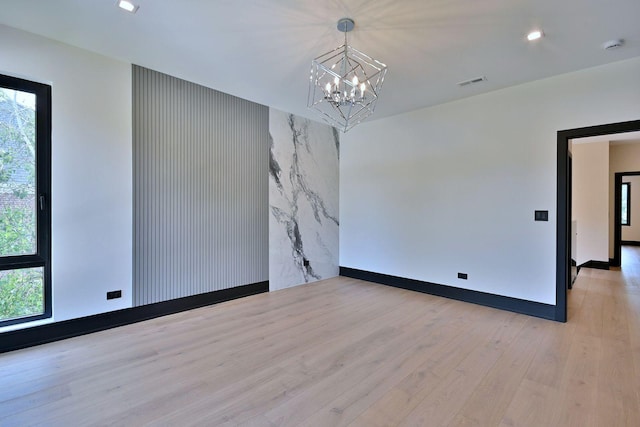 332 W Fremont Ave, Elmhurst, IL 60126 - spare room featuring a chandelier, light wood finished floors, an accent wall, recessed lighting, and a smoke detector