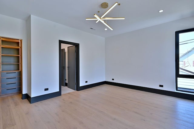 332 W Fremont Ave, Elmhurst, IL 60126 - unfurnished bedroom featuring light wood-type flooring and baseboards