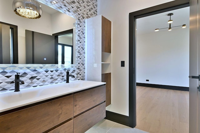 332 W Fremont Ave, Elmhurst, IL 60126 - bathroom featuring double vanity and a chandelier