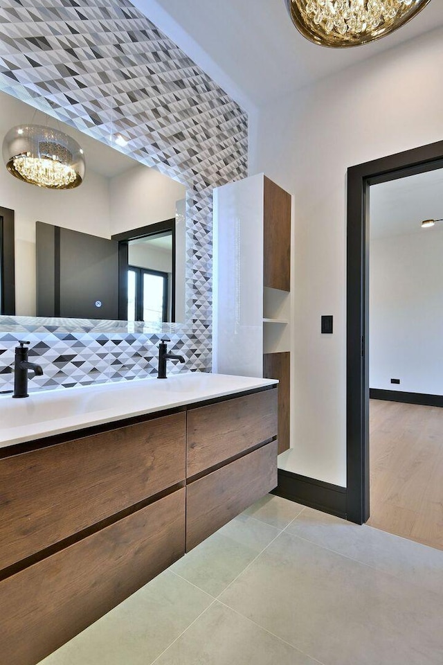 332 W Fremont Ave, Elmhurst, IL 60126 - bathroom with a chandelier, double vanity, and tile patterned flooring