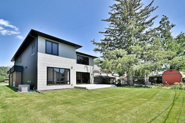 332 W Fremont Ave, Elmhurst, IL 60126 - rear view of property featuring a storage shed, a yard, and a patio area